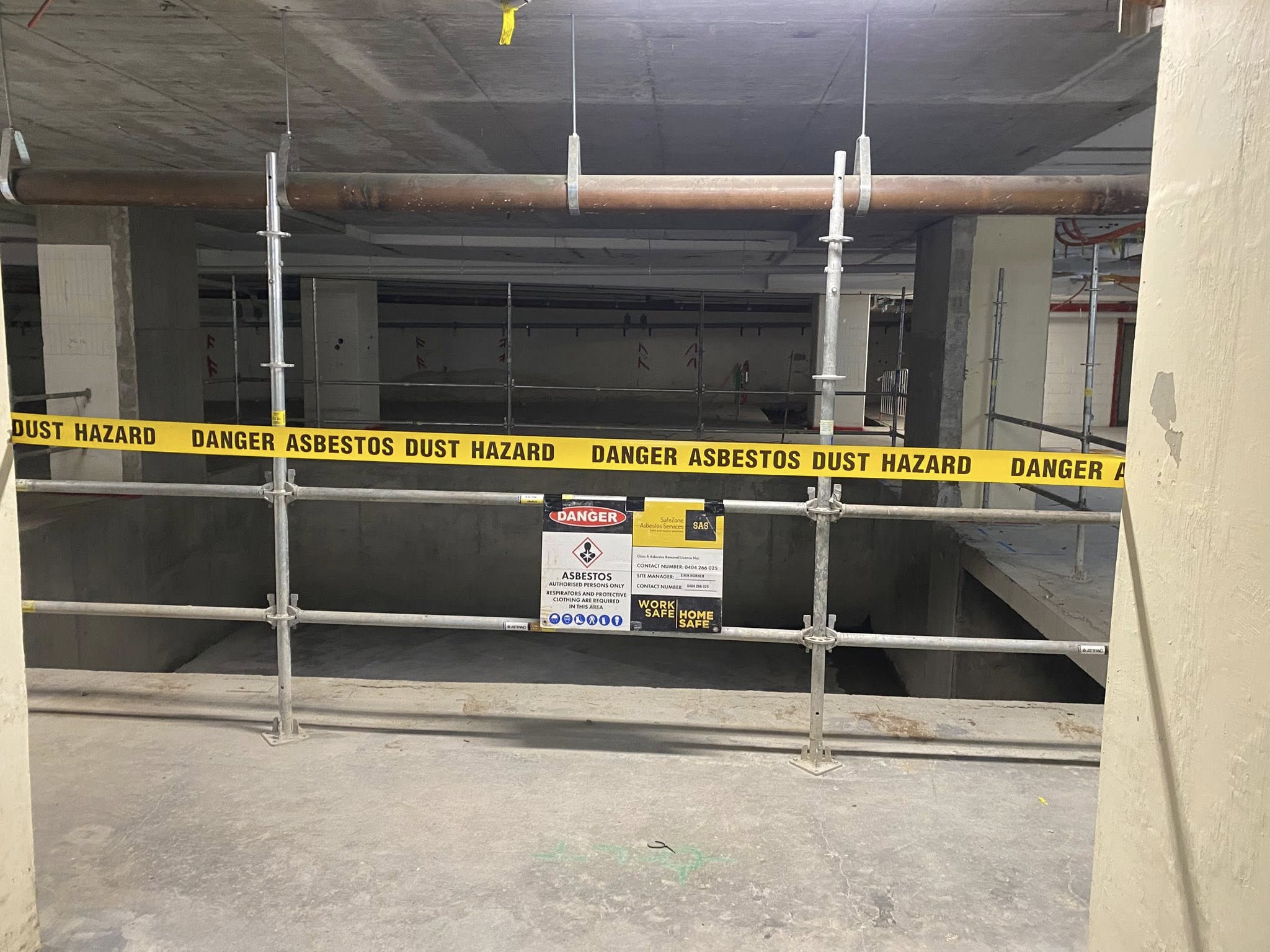 Licensed asbestos removalists sealing contaminated area