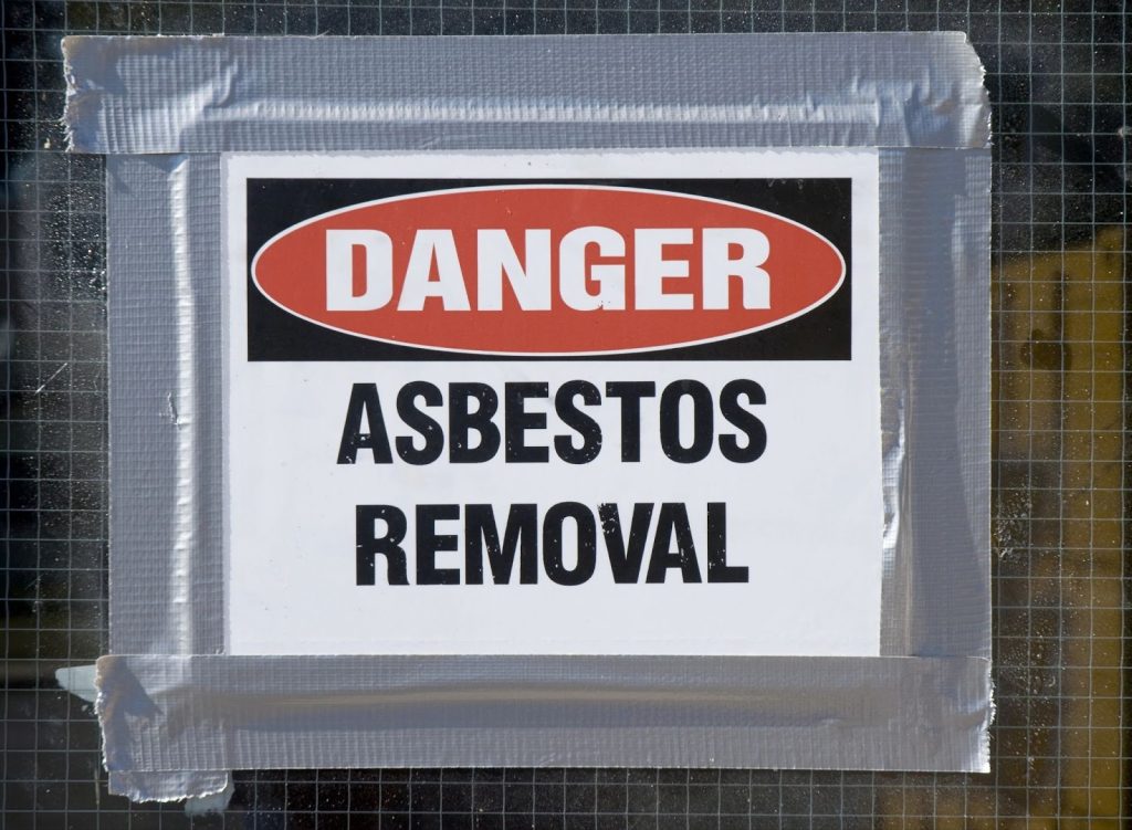 Danger Asbestos Removal warning sign taped to a surface